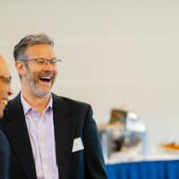 Three guests talking together.